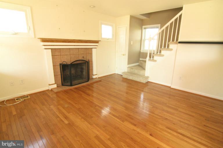 703 Dorchester Road Baltimore, MD 21229 - Photo 18 of 27 a view of empty room with wooden floor
