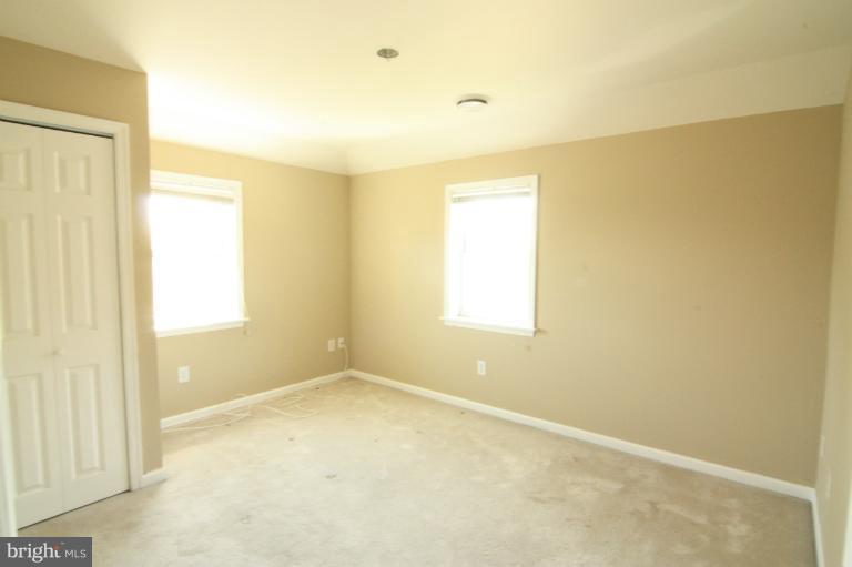 703 Dorchester Road Baltimore, MD 21229 - Photo 20 of 27 a view of an empty room with a window