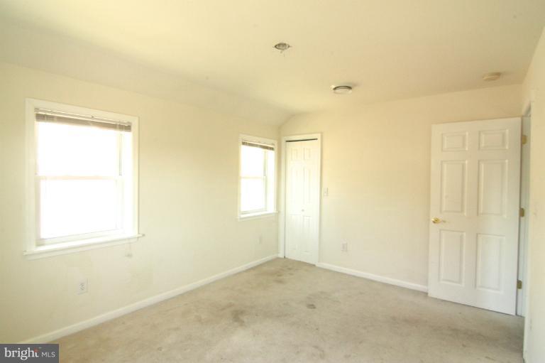 703 Dorchester Road Baltimore, MD 21229 - Photo 4 of 27 a view of a room that has a window in it