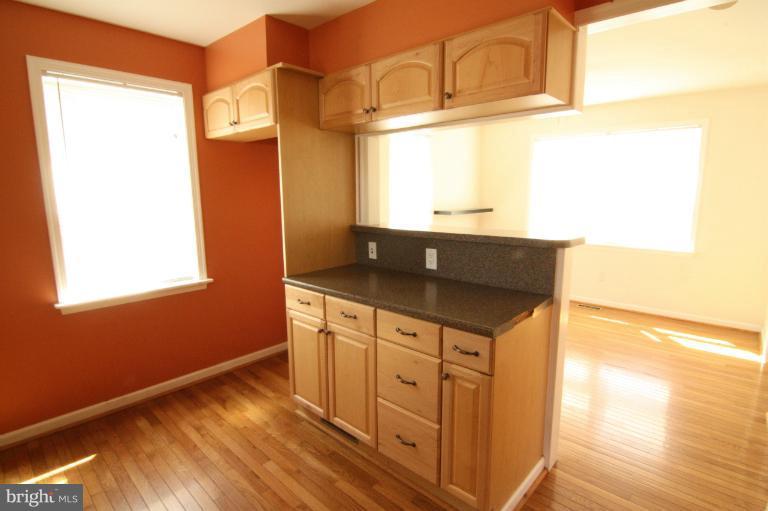703 Dorchester Road Baltimore, MD 21229 - Photo 8 of 27 a kitchen with granite countertop a sink and a granite counter top