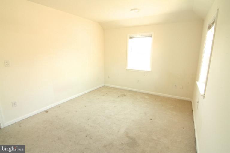 703 Dorchester Road Baltimore, MD 21229 - Photo 9 of 27 an empty room with a window