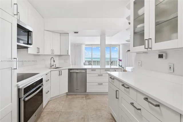 a bedroom with two beds and a large window