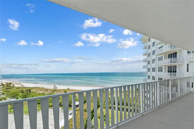 a view of a swimming pool and lounge chairs