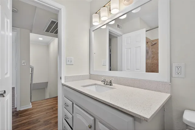 a bathroom with a sink double vanity and a mirror