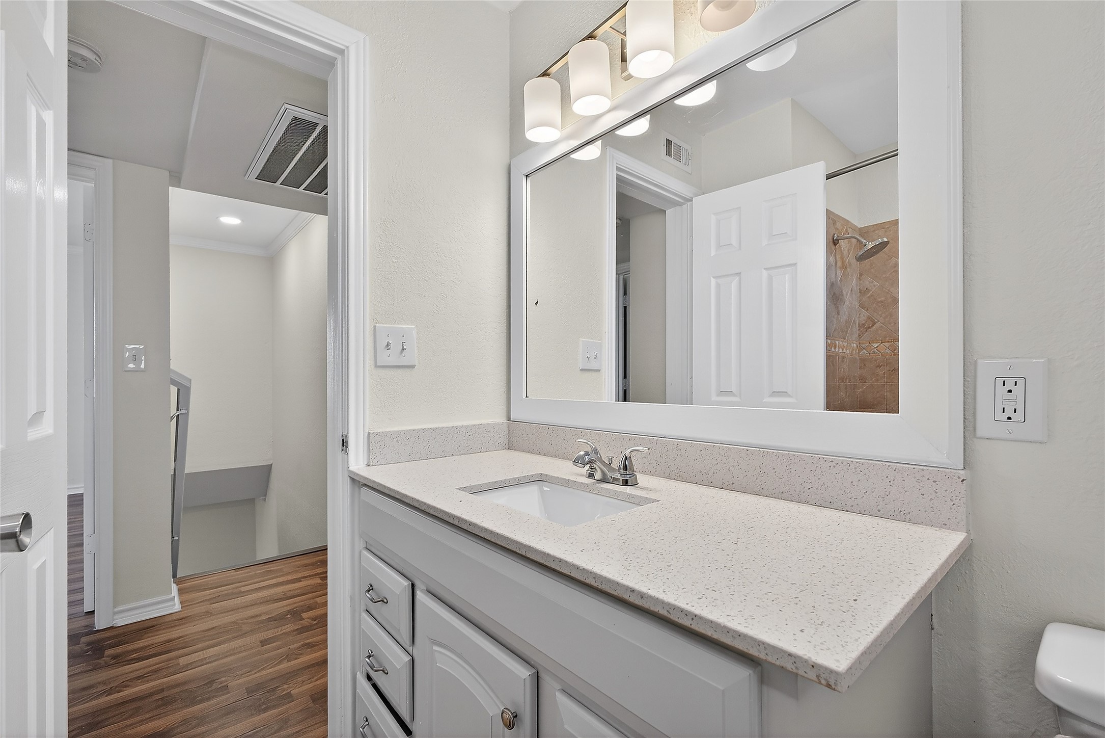 1221 Cedar Post Lane, Unit 1B Houston, TX 77055 - Photo 16 of 23 a bathroom with a sink double vanity and a mirror