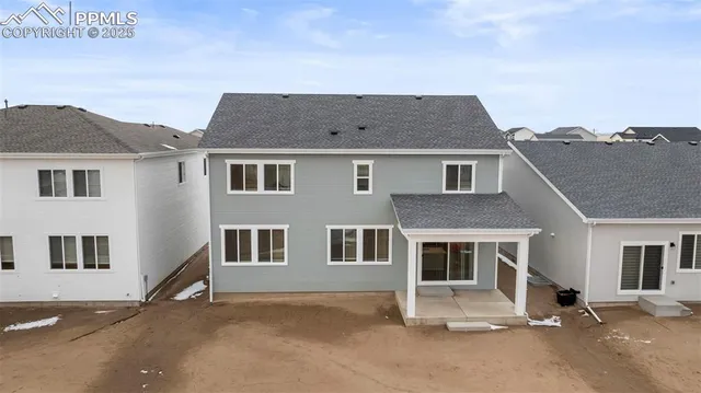 a house that has a tree in front of it
