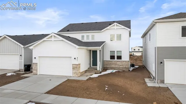 a front view of a house with a garage