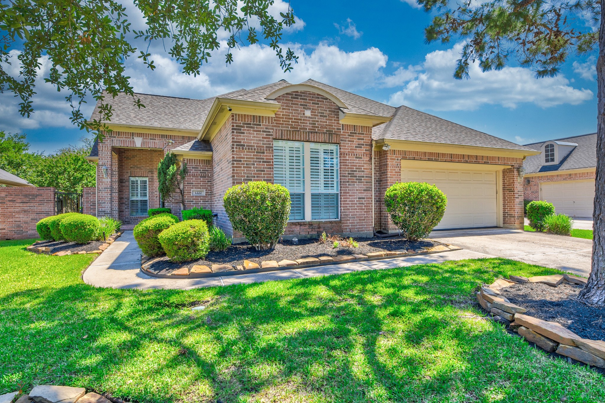 1222 Brinson Court Spring, TX 77379 - Photo 3 of 35 a front view of a house with garden