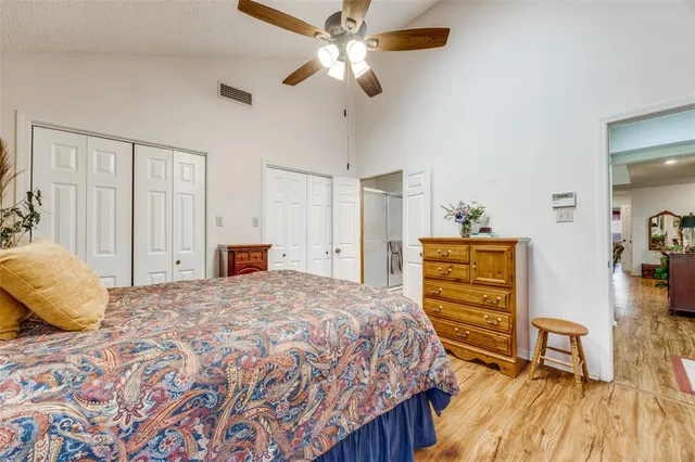 a bedroom with a bed and a dresser in it