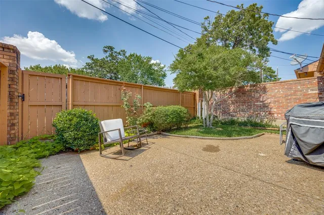 a view of a car park in front of house