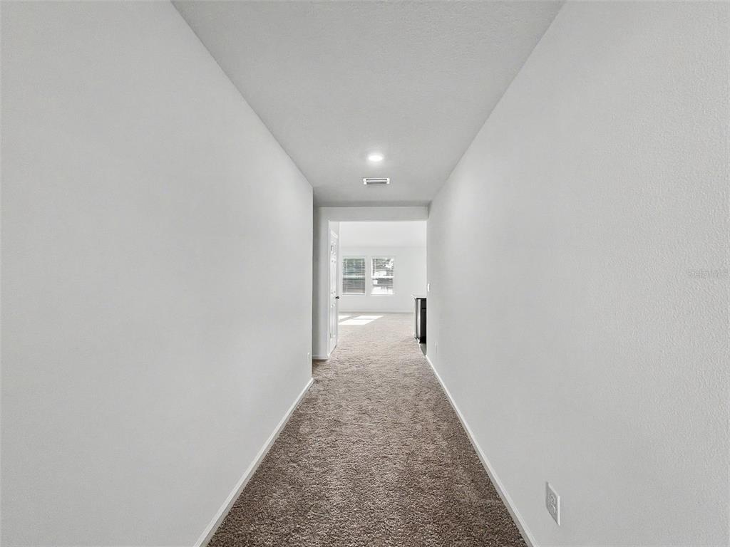 55 Signet Circle Flagler Beach, FL 32136 - Photo 12 of 39 a view of a hallway with a white walls