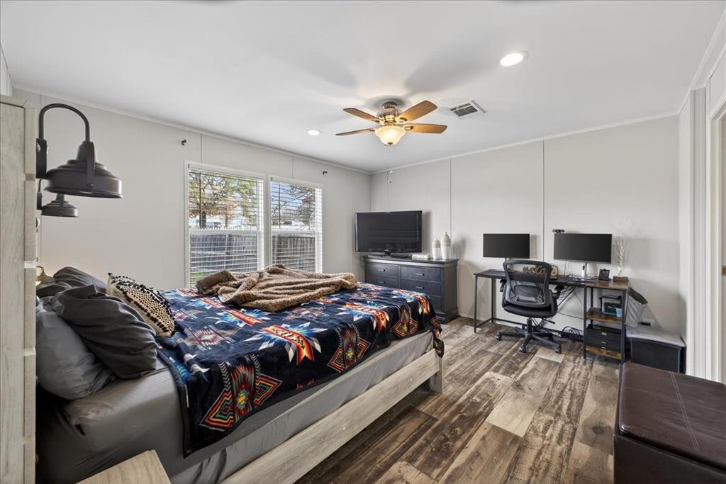 3605 Mockingbird Circle Cleburne, TX 76031 - Photo 22 of 40 Bedroom with wood finished floors, an office area, crown molding, a ceiling fan, and recessed lighting
