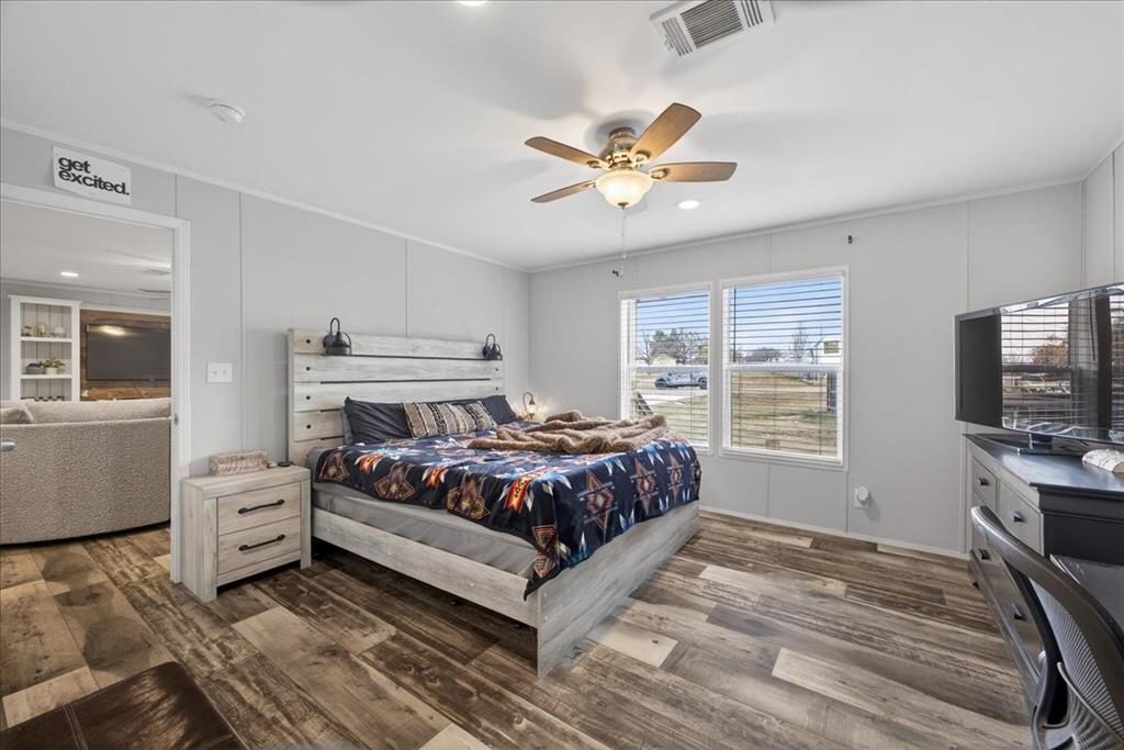 3605 Mockingbird Circle Cleburne, TX 76031 - Photo 23 of 40 Bedroom featuring dark wood-style flooring, ceiling fan, crown molding, and recessed lighting