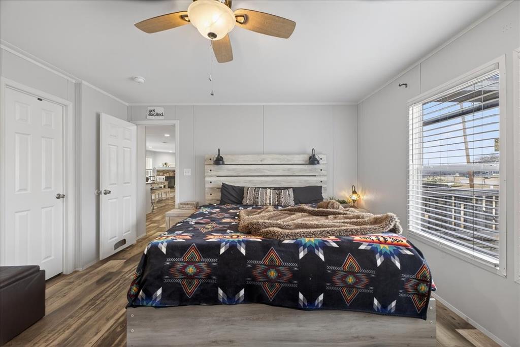 3605 Mockingbird Circle Cleburne, TX 76031 - Photo 24 of 40 Bedroom with wood finished floors, crown molding, and a ceiling fan