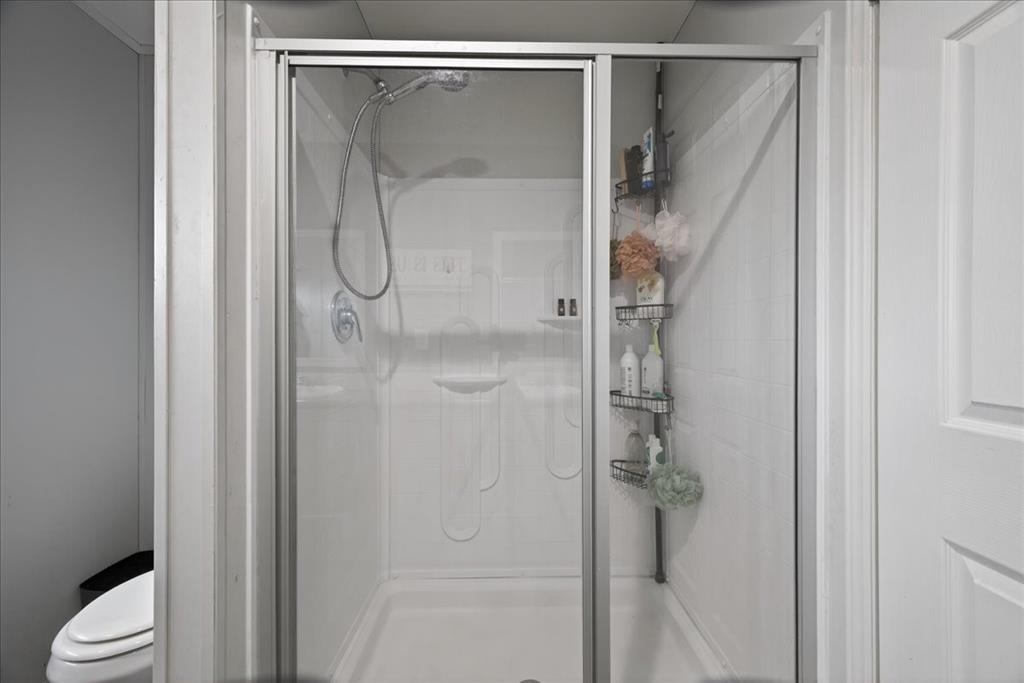 3605 Mockingbird Circle Cleburne, TX 76031 - Photo 29 of 40 Bathroom with a stall shower and toilet