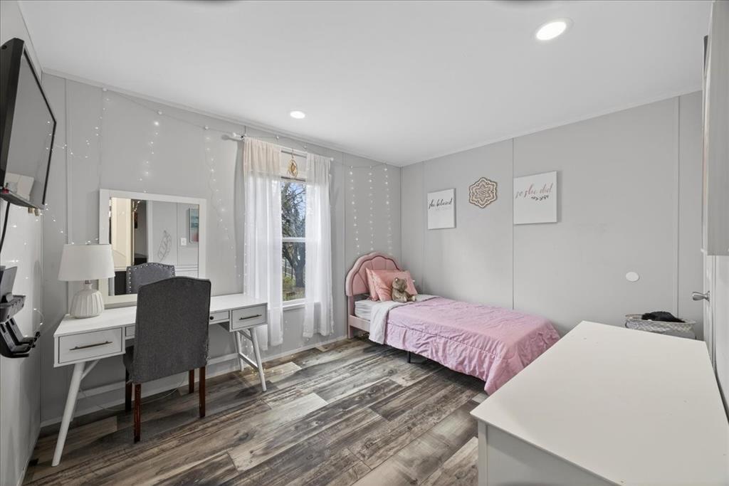 3605 Mockingbird Circle Cleburne, TX 76031 - Photo 30 of 40 Bedroom featuring dark wood-style flooring, an office area, and recessed lighting