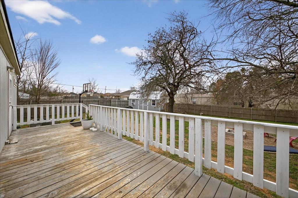 3605 Mockingbird Circle Cleburne, TX 76031 - Photo 35 of 40 Wooden deck featuring a fenced backyard and a shed
