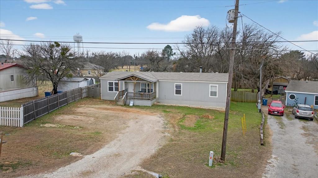 3605 Mockingbird Circle Cleburne, TX 76031 - Photo 4 of 40 Manufactured / mobile home featuring dirt driveway and a wooden deck