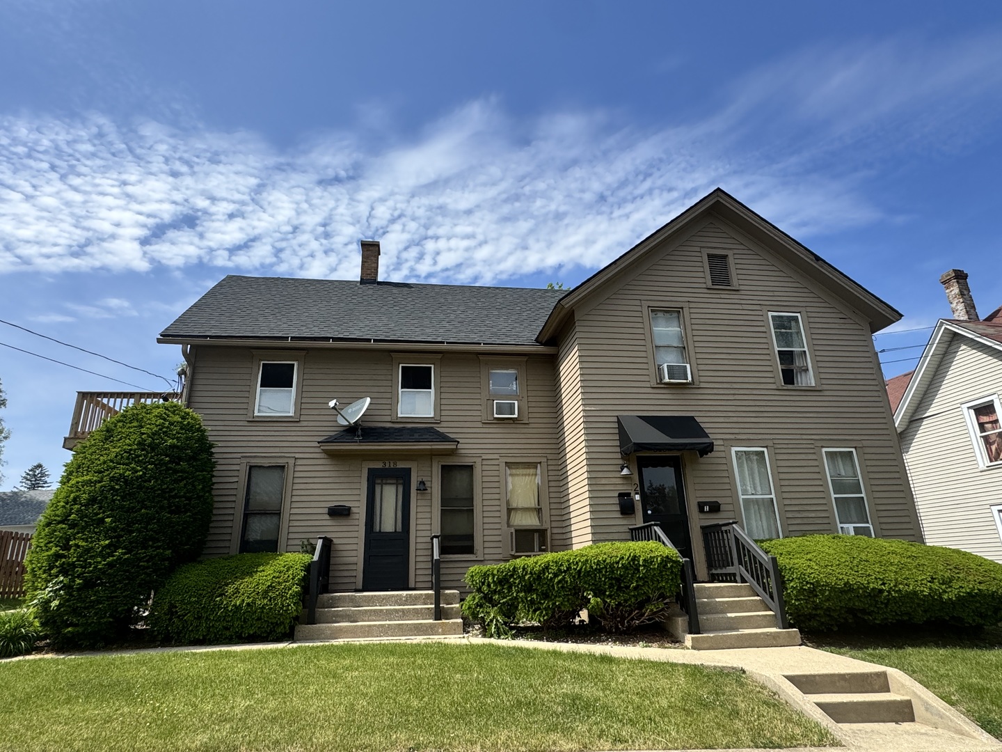 316 Lawrence Avenue Elgin, IL 60123 - Photo 1 of 8 a front view of a house with a yard