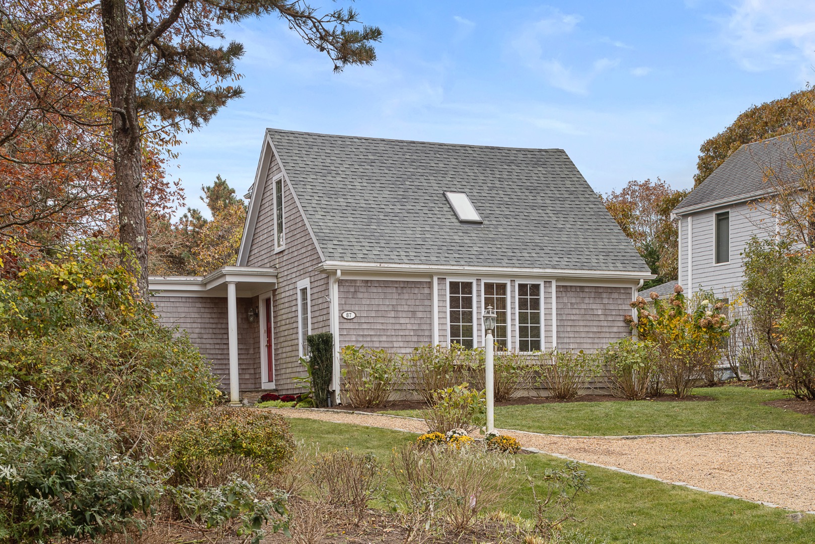 87 Schoolhouse Road Edgartown, MA 02539 - Photo 1 of 29 front view of house with a yard