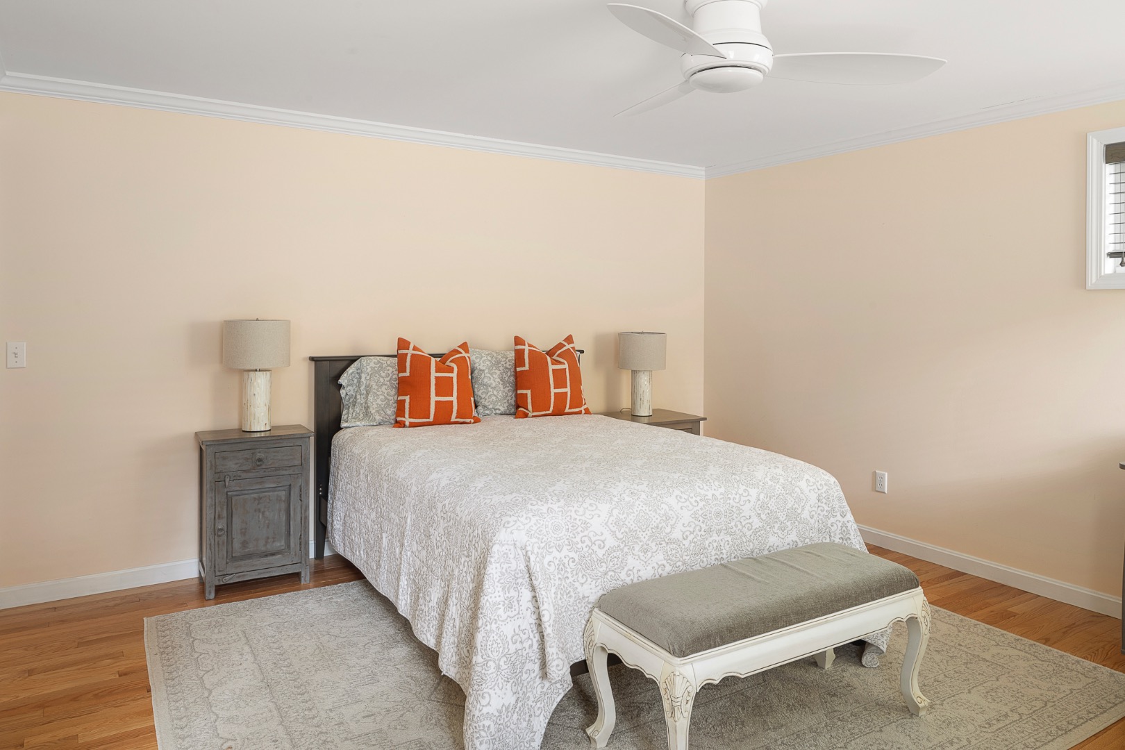 87 Schoolhouse Road Edgartown, MA 02539 - Photo 13 of 29 a bedroom with a bed and wooden floor