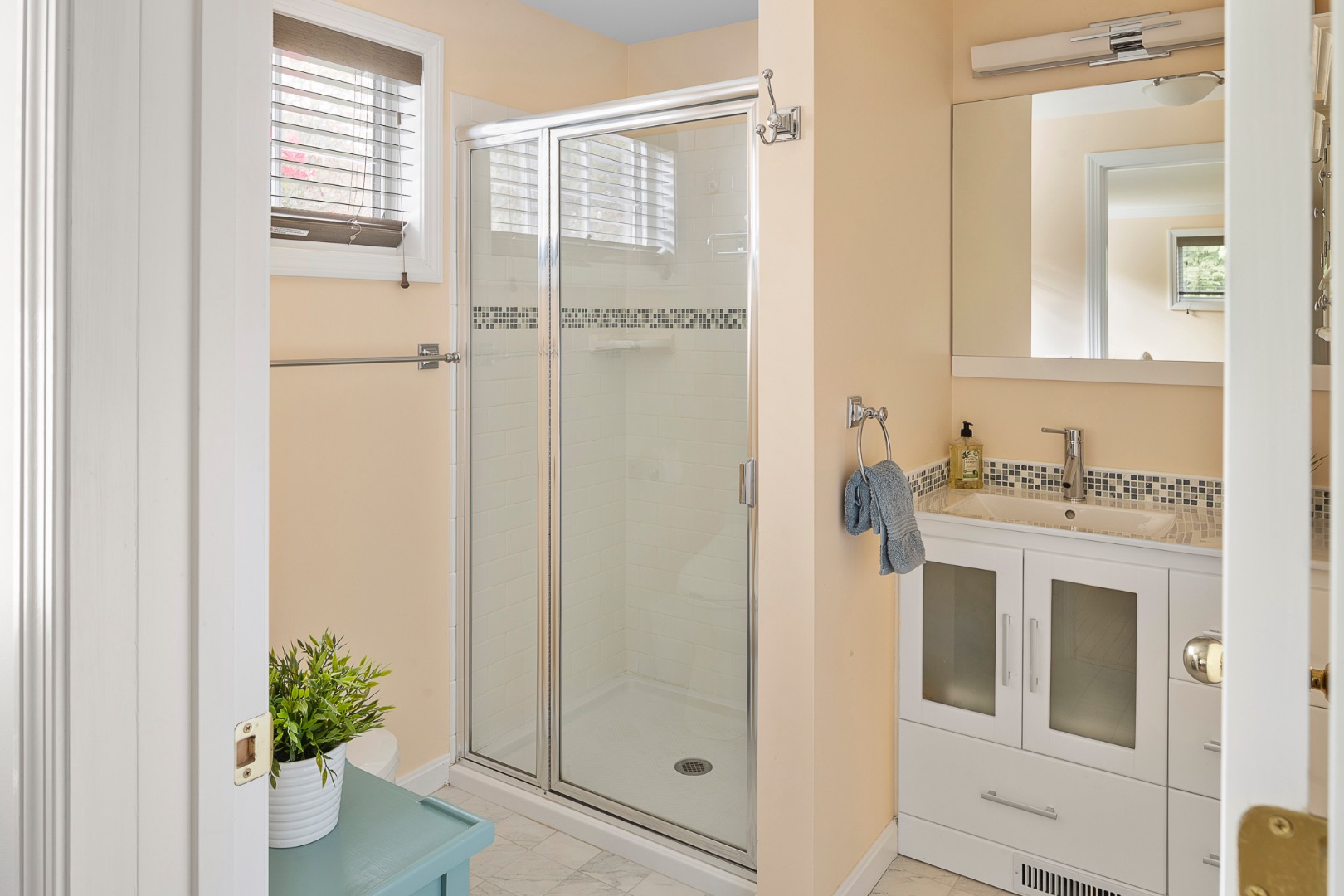 87 Schoolhouse Road Edgartown, MA 02539 - Photo 15 of 29 a bathroom with a sink and a mirror