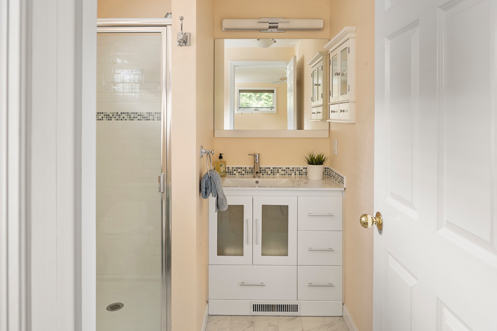 87 Schoolhouse Road Edgartown, MA 02539 - Photo 16 of 29 a bathroom with a sink and a mirror