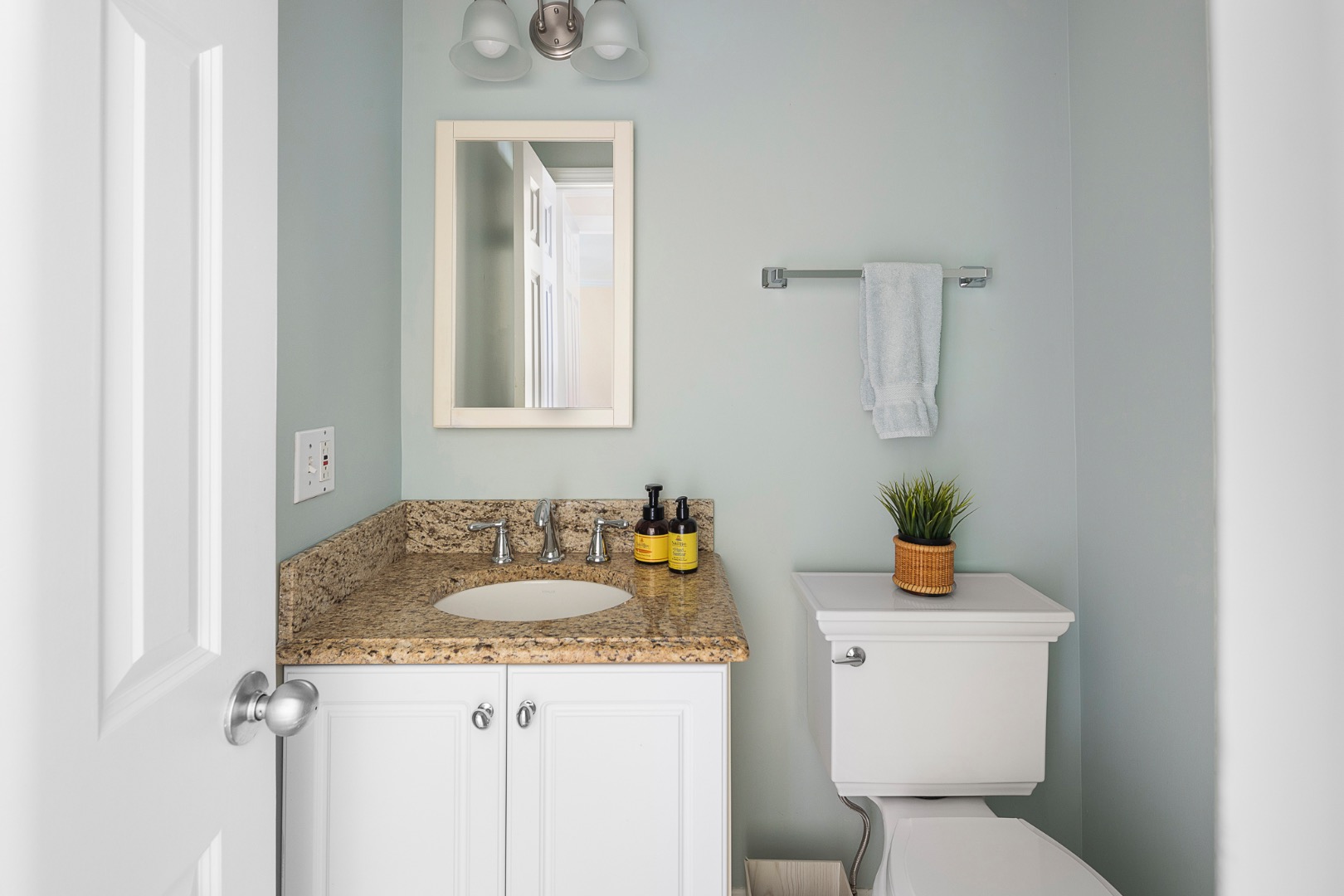 87 Schoolhouse Road Edgartown, MA 02539 - Photo 18 of 29 a bathroom with a granite countertop sink and a toilet