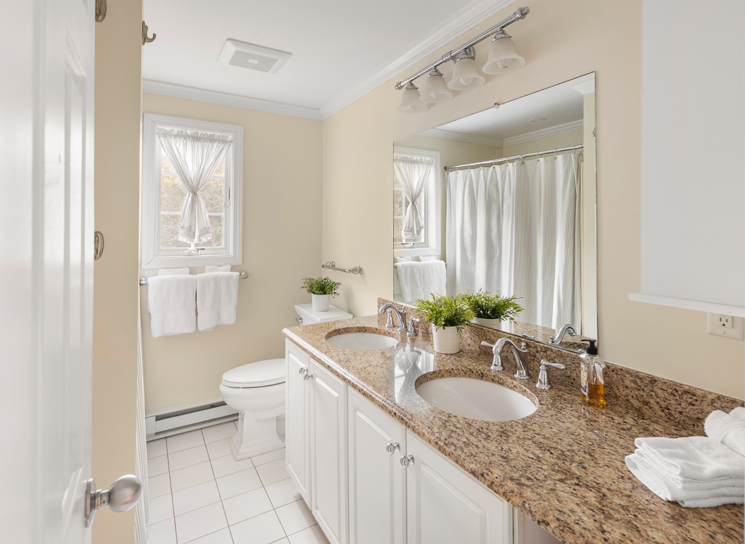 87 Schoolhouse Road Edgartown, MA 02539 - Photo 25 of 29 a bathroom with a granite countertop sink and a mirror