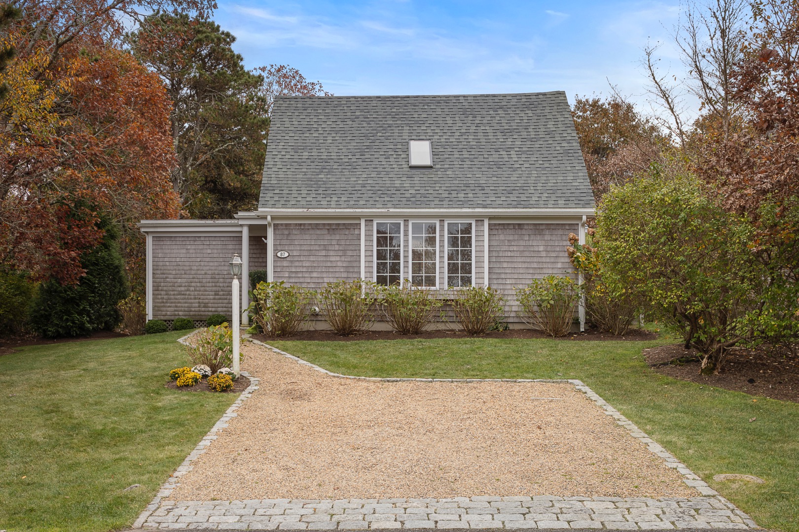 87 Schoolhouse Road Edgartown, MA 02539 - Photo 27 of 29 front view of a house with a yard