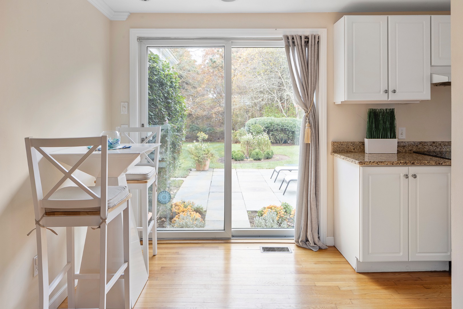 87 Schoolhouse Road Edgartown, MA 02539 - Photo 9 of 29 a view of a kitchen with furniture and wooden floor