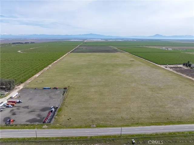 a view of a field with an ocean