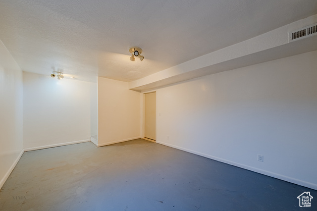 6178 East Zion Road Kanab, UT 84741 - Photo 39 of 48 Unfurnished room featuring finished concrete floors and a textured ceiling