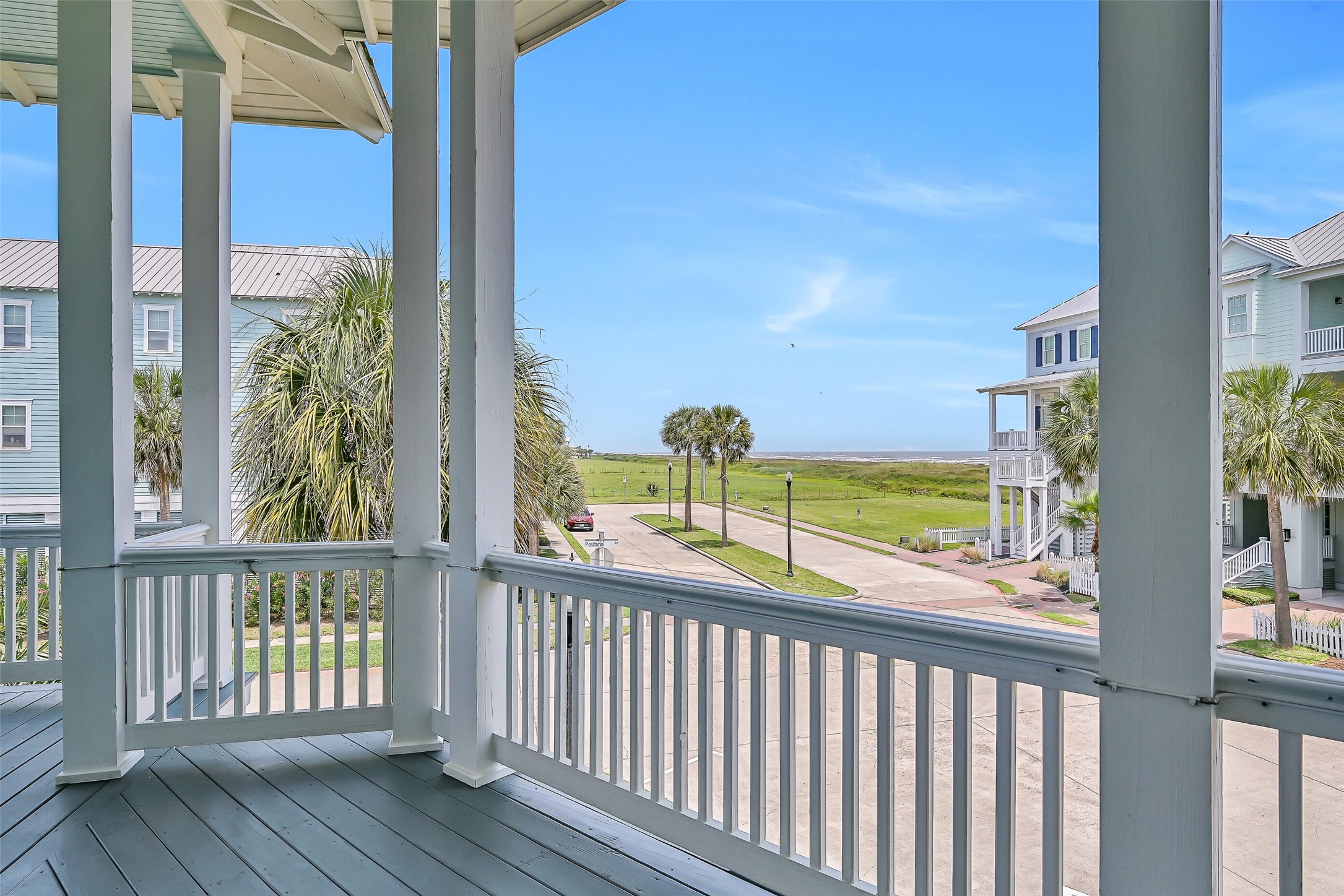 817 Positano Road Galveston, TX 77550 - Photo 46 of 50 A glimpse of the Gulf and open coastal scenery creates a beautiful backdrop from this elevated porch. The combination of fresh sea air and relaxing views makes outdoor living truly enjoyable.