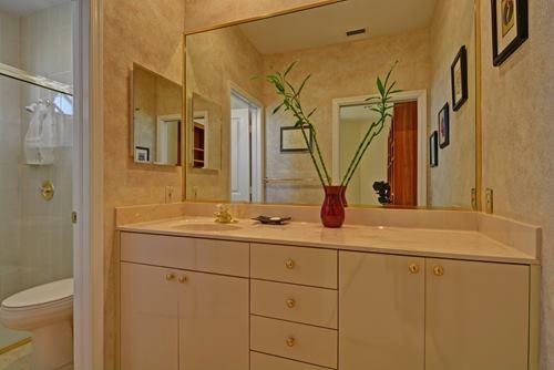 5156 Northwest 26th Circle Boca Raton, FL 33496 - Photo 10 of 18 a bathroom with a sink and mirror with toilet