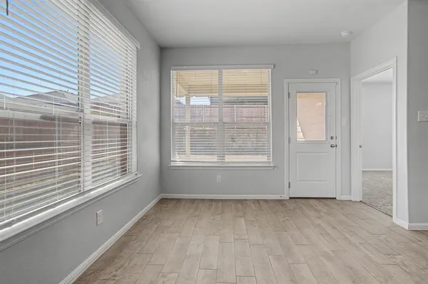 a view of an empty room with a window