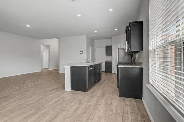 a kitchen with stainless steel appliances a refrigerator and a sink