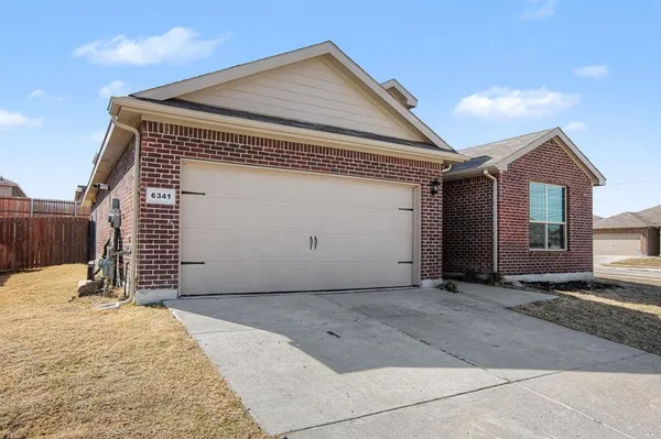 a front view of a house with a garage