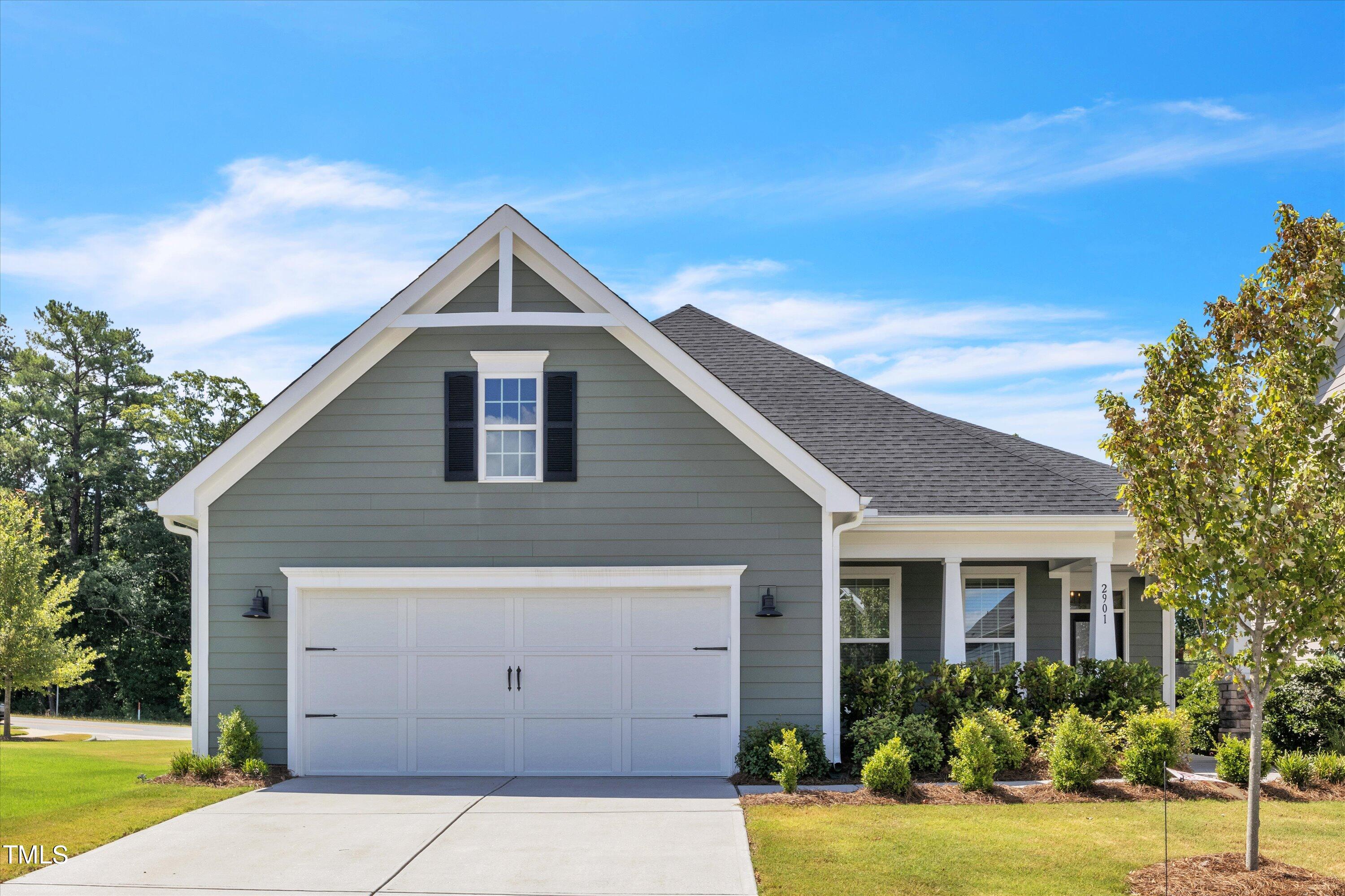 2901 Thurman Dairy Loop Wake Forest, NC 27587 - Photo 1 of 28 a front view of house with yard and trees around