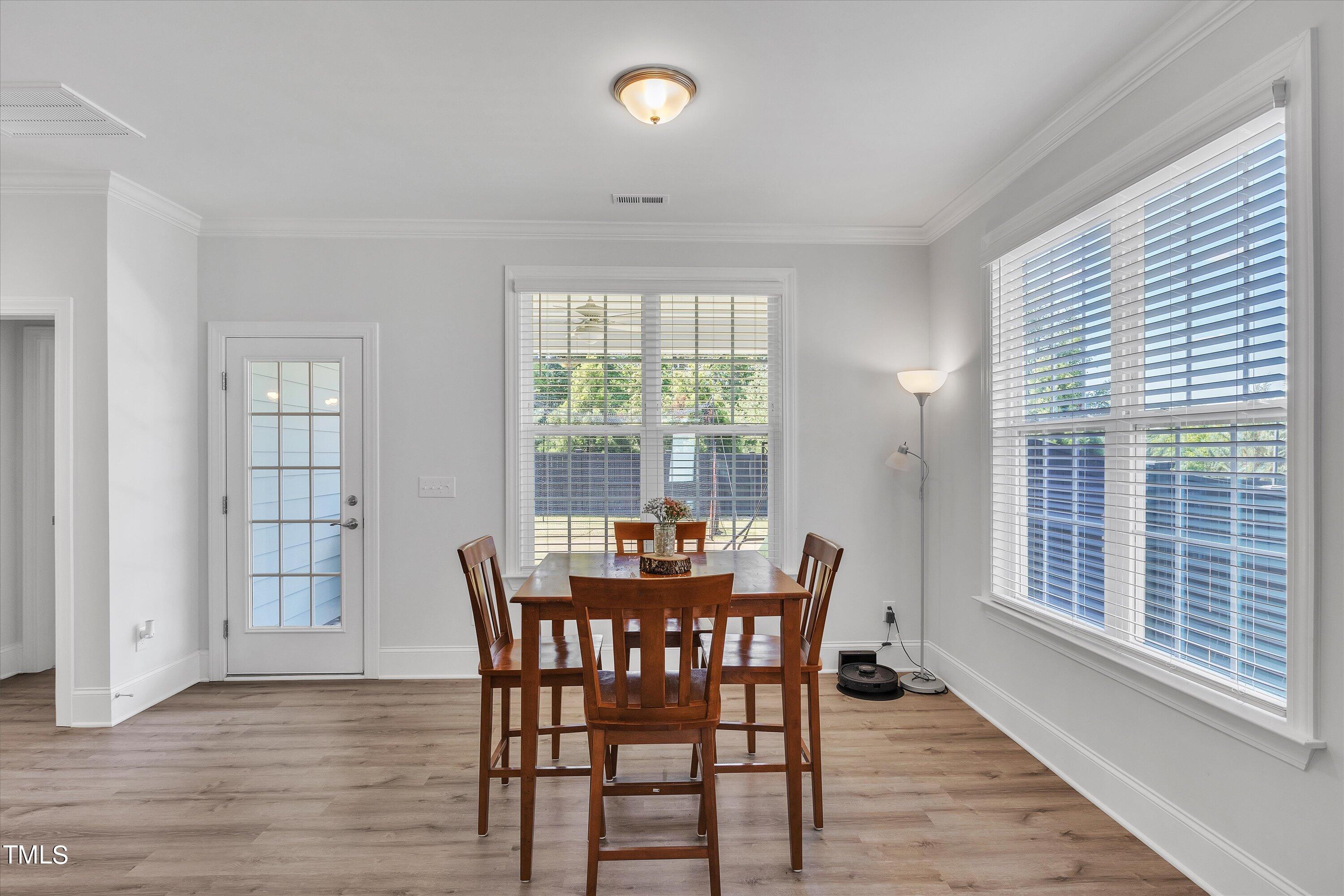 2901 Thurman Dairy Loop Wake Forest, NC 27587 - Photo 10 of 28 a dining room with furniture and wooden floor