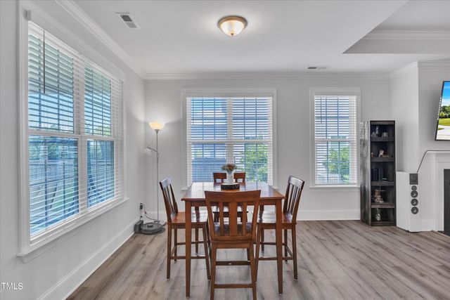 a kitchen with white cabinets and a stove