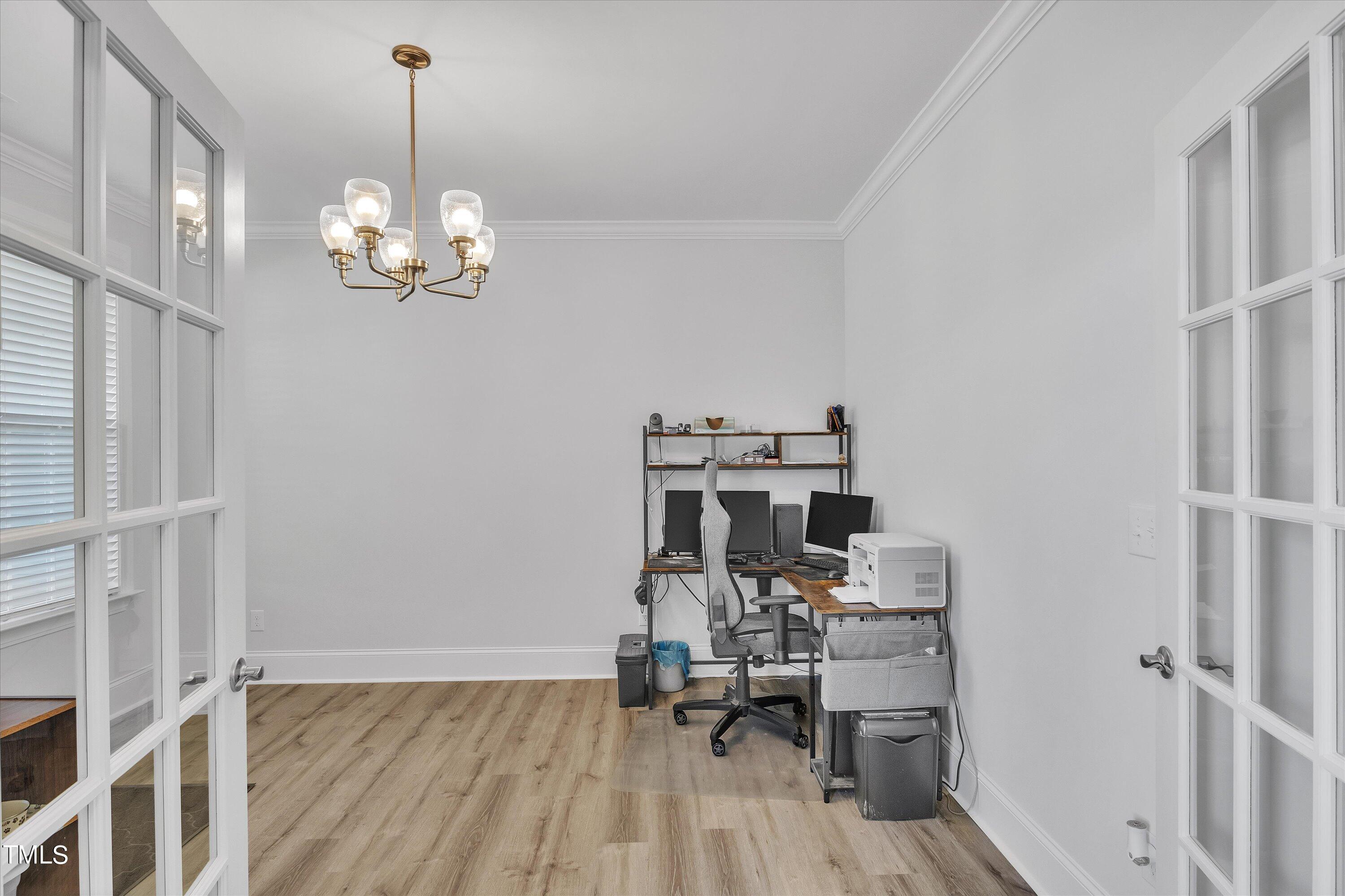 2901 Thurman Dairy Loop Wake Forest, NC 27587 - Photo 13 of 28 a view of a dining room with furniture wooden floor and chandelier