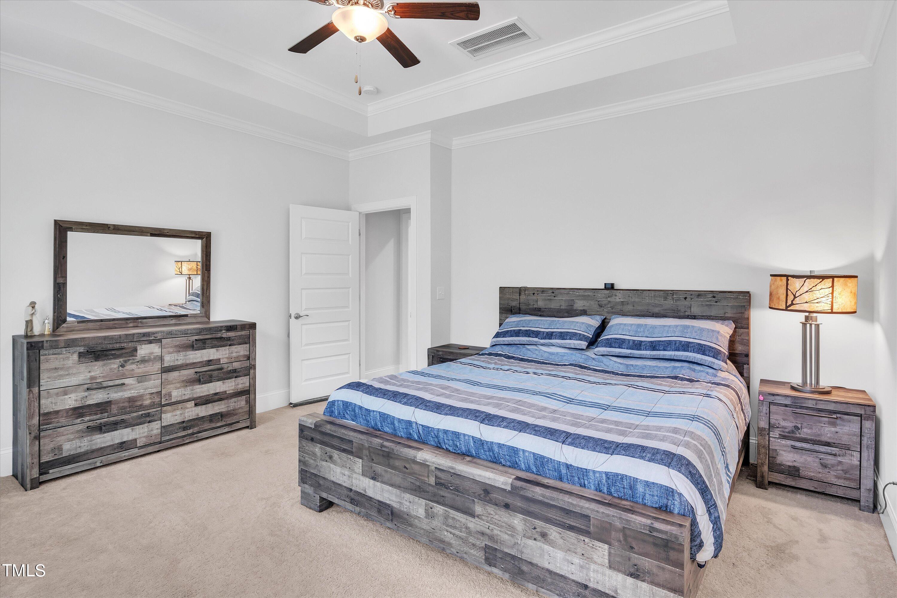2901 Thurman Dairy Loop Wake Forest, NC 27587 - Photo 15 of 28 a bedroom with a bed and a flat screen tv