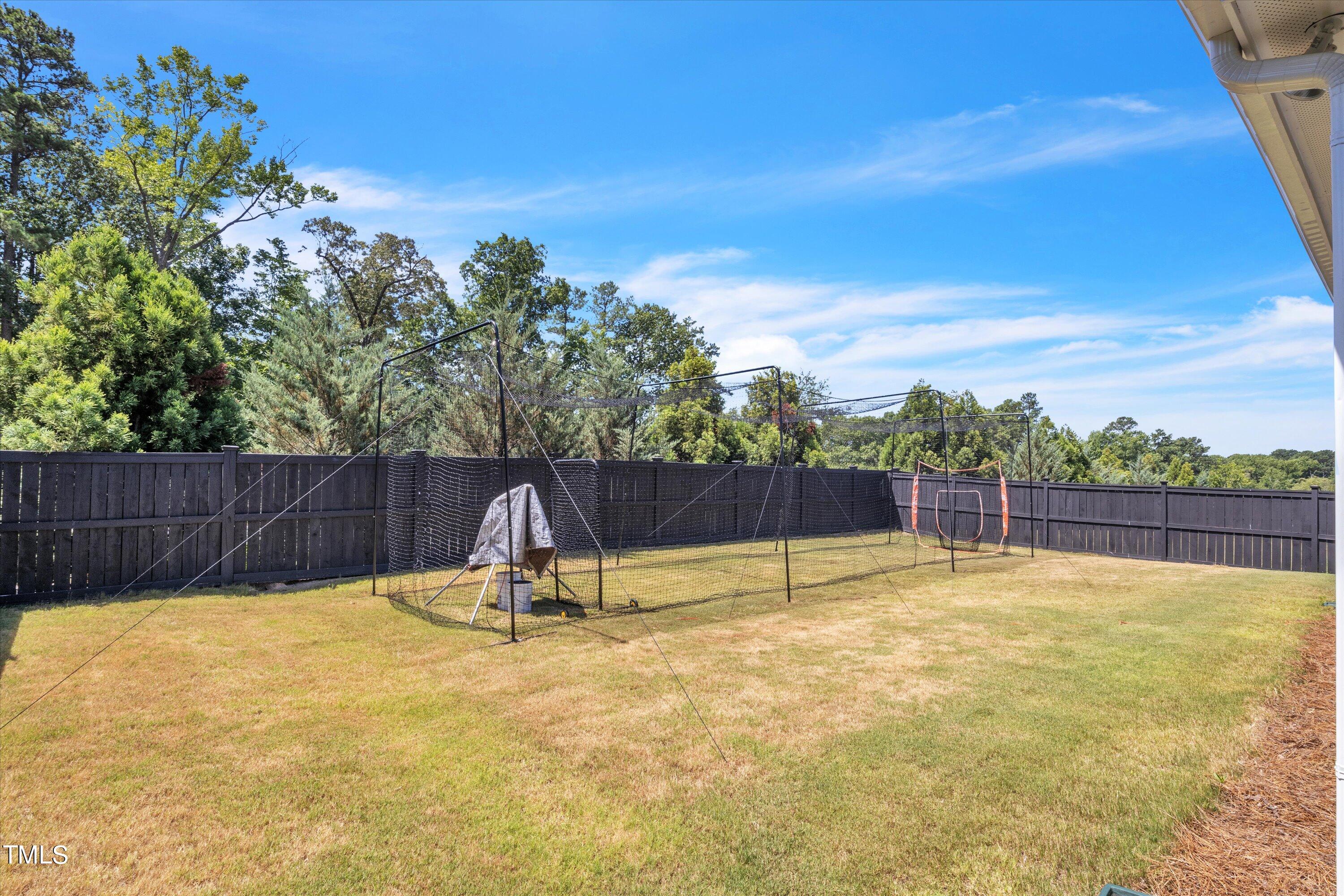 2901 Thurman Dairy Loop Wake Forest, NC 27587 - Photo 3 of 28 a view of a swimming pool with a patio and wooden fence