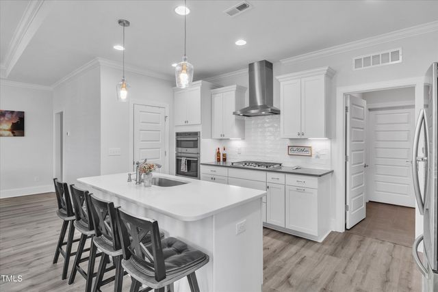 a balcony with furniture and large window