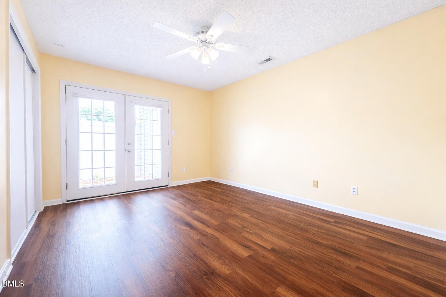 5010 Avenida Del Sol Drive Raleigh, NC 27616 - Photo 20 of 27 an empty room with wooden floor and windows