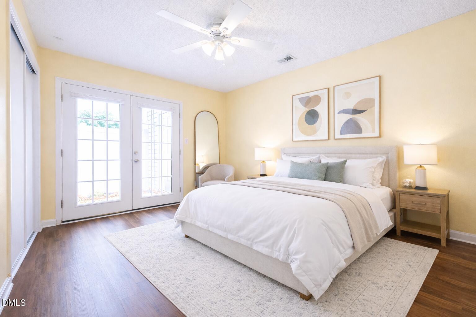 5010 Avenida Del Sol Drive Raleigh, NC 27616 - Photo 21 of 27 a spacious bedroom with a large bed and a chandelier