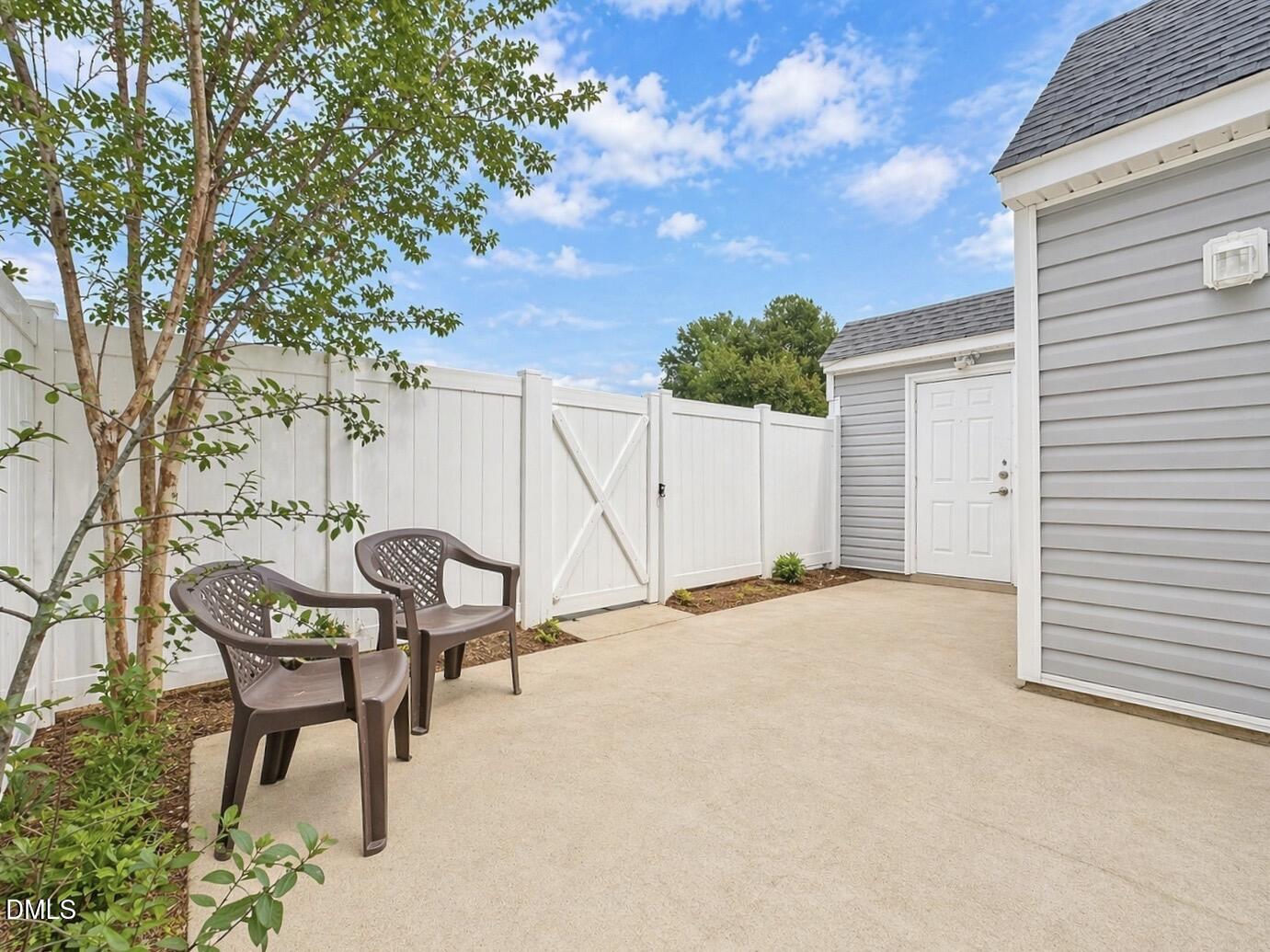 5010 Avenida Del Sol Drive Raleigh, NC 27616 - Photo 22 of 27 a view of a backyard with a sitting area