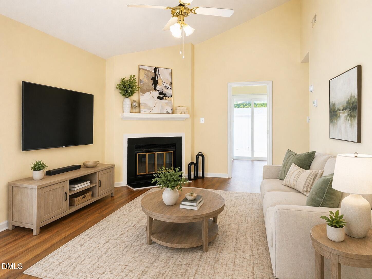 5010 Avenida Del Sol Drive Raleigh, NC 27616 - Photo 6 of 27 a living room with furniture and a flat screen tv