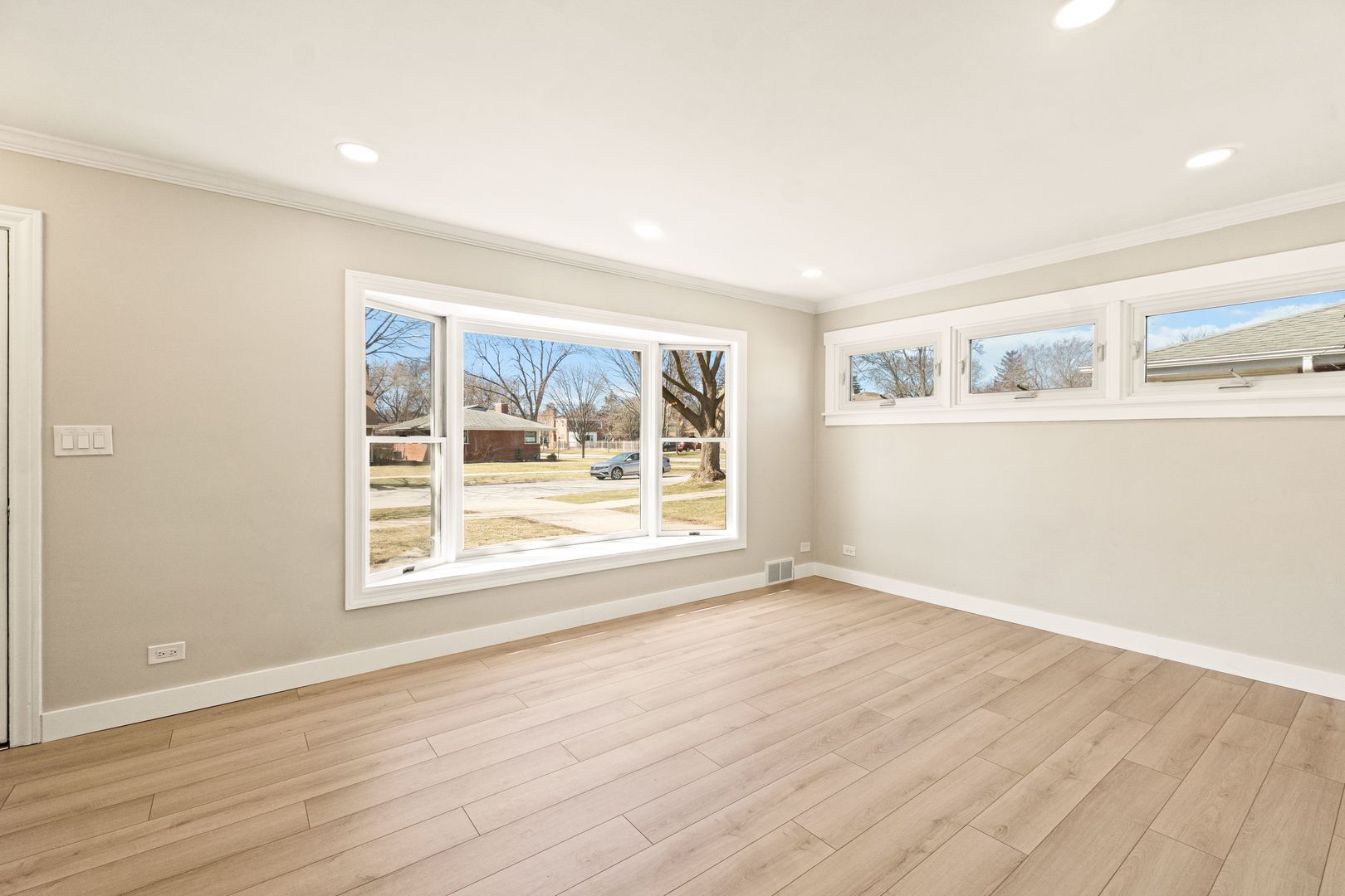 219 North Pine Street Mount Prospect, IL 60056 - Photo 11 of 20 an empty room with wooden floor and window
